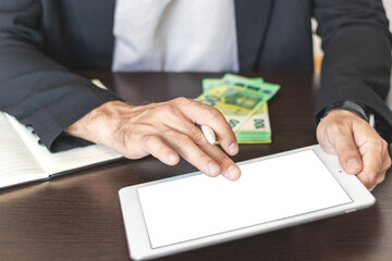 Businessman touching with finger blank screen of a digital tablet.