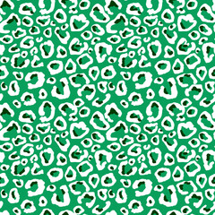 Leopard, cheetah skin print. Animal fur seamless pattern. White spots on green background repeat print. Wild life design for textile, fabric, wallpaper, wrapping paper, decoration.