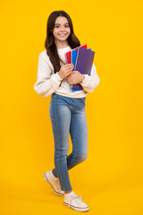 Schoolgirl with copy book posing on isolated background. Literature lesson, grammar school. Intellectual child reader. Happy face, positive and smiling emotions of teenager girl.