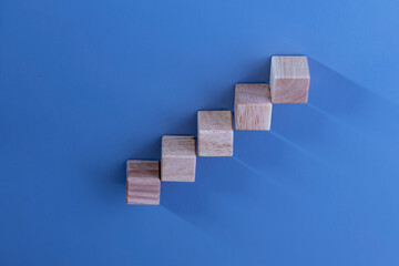 Wooden dice arranged in steps