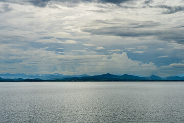 Kra Siew Dam, a tourist attraction in Kanchanaburi, Thailand, the sky is overcast, the rain is about to fall