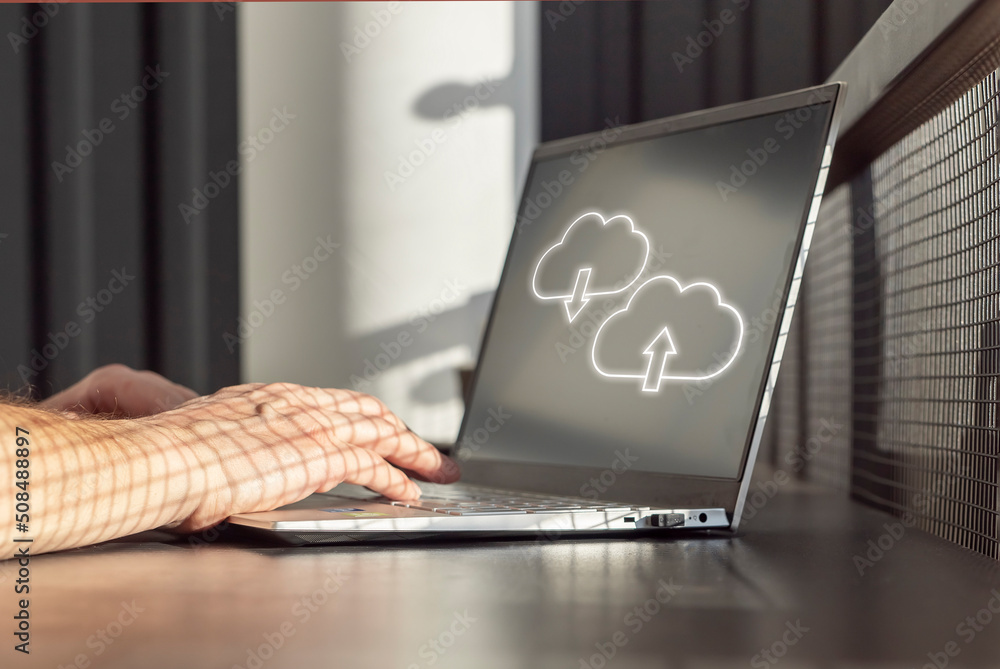 Poster Cloud computing. Man using laptop for upload, storage, download or sharing files and data online. Male hands on computer keyboard closeup. High quality photo