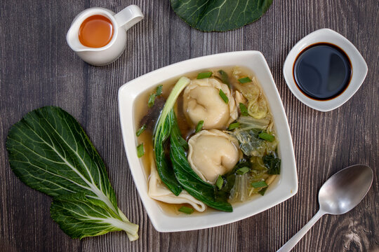 Wantan soup, oriental Chinese dish, Chifa Chinese-Peruvian cuisine, with bok choy and other ingredients