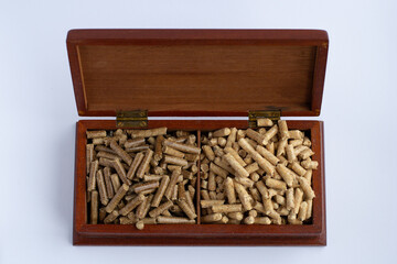 wood pellets for firebox, light and dark for comparison, elite pellets in a wooden box, beautifully...