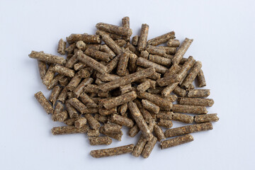 wooden pellet for firebox, randomly lying, dark eco product, for catalog