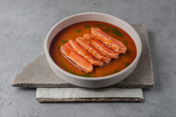 salmon tataki with ponzu sauce on gray background