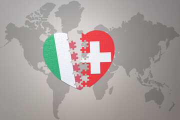 puzzle heart with the national flag of switzerland and italy on a world map background. Concept.