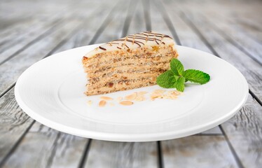 Slice of  sweet Pie with Cream on a white plate