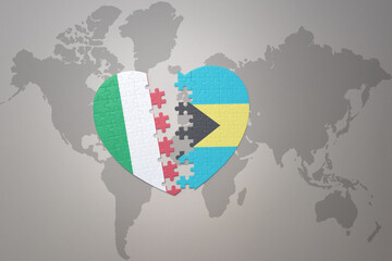 puzzle heart with the national flag of bahamas and italy on a world map background. Concept.