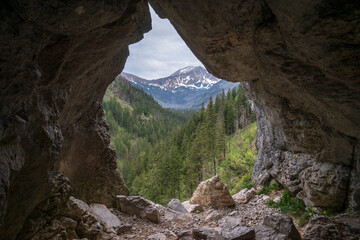 The view from the Mylna cave through the Pawlikowski window on the Koscieliska Valley. Tatra Mountains.