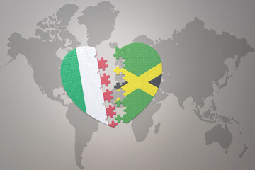 puzzle heart with the national flag of jamaica and italy on a world map background. Concept.