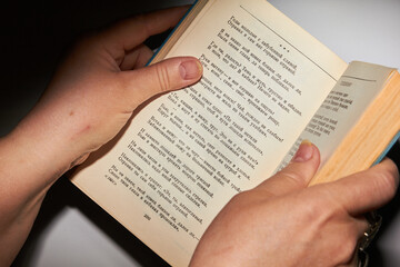 hands holding a book