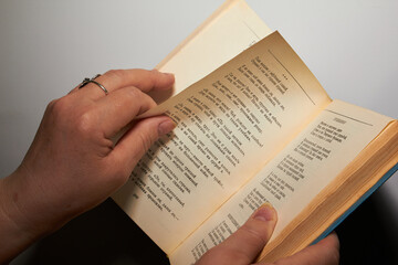 hands holding a book