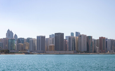 Fototapeta na wymiar Water and Abu Dhabi skyline in the background, UAE