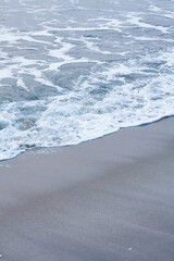 Bubbles on golden beach with ocean water in the morning at Thailand beaches.