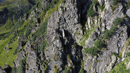 Aerial view of rocky peak of Spitz mountain in the Carpathian mountains, landscape of summer mountains.