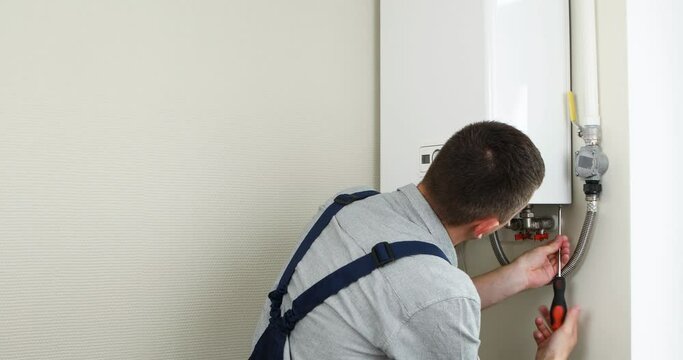 Plumber trying to solve a problem with domestic heating equipment.