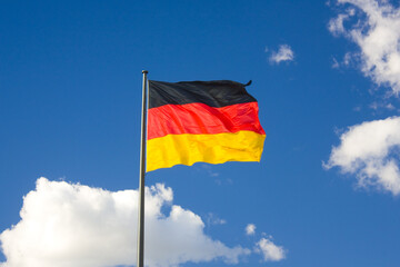 German flag in front of the blue sky	