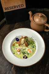 Okroshka on a wooden board 

