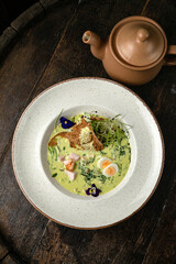 Okroshka on a wooden board 
