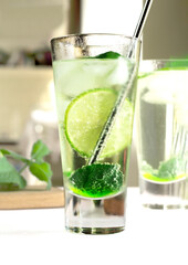summer drink. lemonade. selective focus. refreshing detox drink with mint ginger and lemon. Cold mojito cocktail. mint soft drink is healthy. Fresh mint, lime slices in cold water. High quality photo