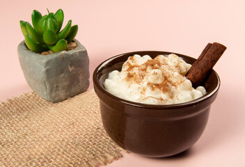traditional sweet from the Brazilian June festivals, made of white corn with coconut and condensed milk and sprinkled with cinnamon