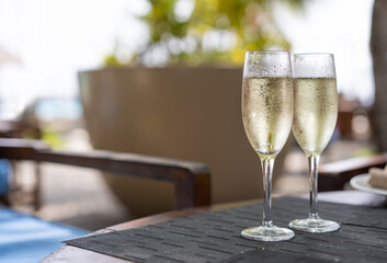 Two glasses of champagne in a restaurant on the coast of a resort in the Maldives