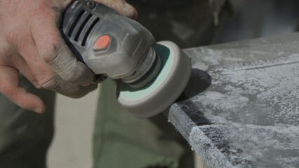Work with a grinder on granite stone. Polishing of granite surface.