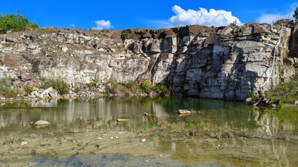 Fototapeta na wymiar view of a partially flooded granite quarry