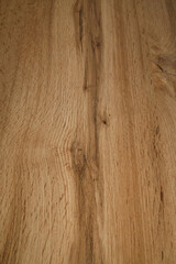 Fototapeta premium Wooden background texture. Light brown surface of old knotty wood with a natural color