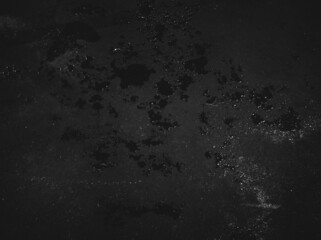 Paint spots wall. Black texture. Stone background. Dark marble. Rock texture. Rock surface with cracks. Rock pile. Grunge Rough structure. Abstract texture.