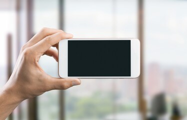 Hand holding Phone with black screen. Streaming movies and TV series.