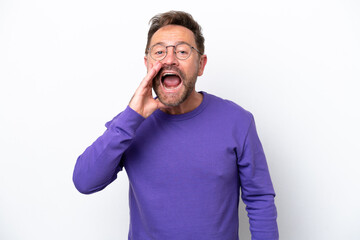 Fototapeta premium Middle age caucasian man isolated on white background shouting with mouth wide open