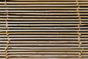 Stacked wooden boards in a line. Wooden background