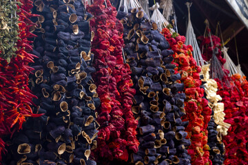 Dried eggplants and peppers and bell chill. The dried ingredient hanging in the local bazaar in...