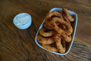 Deep Onion Fried. Homemade Delicious Unhealth Snack.