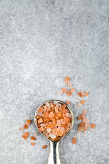 Top view of Himalayan crystal pink salt in a spoon