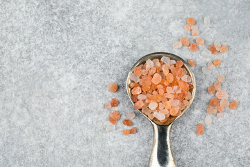 Close up of Himalayan pink salt in a spoon