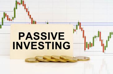 Against the background of the quotes chart, a business card with the inscription - Passive Investing