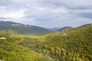 Picturesque landscape of the river Iori and hills covered with forests opening from the highest point of the ruins of the old fortress of Ujarma. Caucasus Mountains, Kakheti region, Georgia