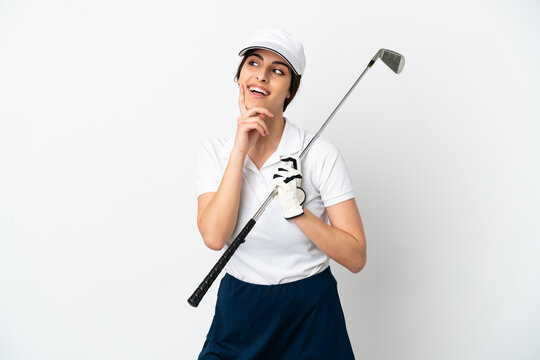 Handsome young golfer player woman isolated on white background thinking an idea while looking up