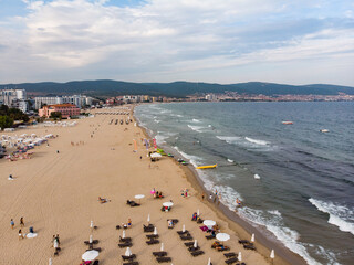 Fototapeta na wymiar Summer holidays in Europe during quarantine. Panoramic view of the sand beach of Sunny Beach in Bulgaria. Aerial photography, drone view.