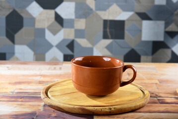 big empty glass for broth, soup and coffee, on wooden table with space for text