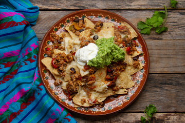 Nachos with guacamole and chilli con carne. Mexican food