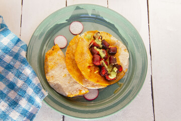 Chistorra quesadillas with green sauce. Mexican food