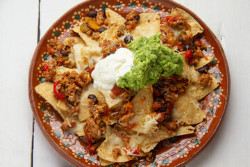 Nachos with guacamole and chilli con carne. Mexican food