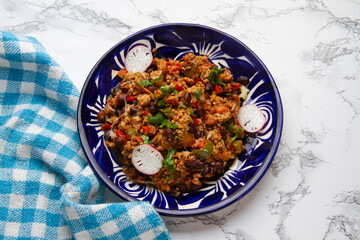 Chilli con carne in talavera plate. Mexican food