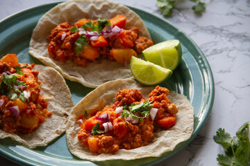 Ground meat tacos called picadillo. Mexican food