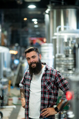 Portrait of a bearded man working in a brewery