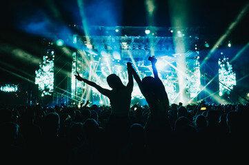 Two woman in the crowd at a music festival